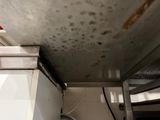 a picture of a kitchen with a lot of mold on the ceiling