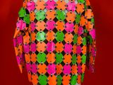 an orange and green jacket on a mannequin mannequin mannequin mannequin mannequin mannequin mannequin mannequin mann