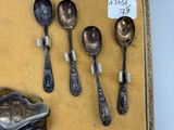 several spoons and spoon spoons are in a box on a table