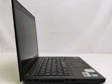 a black laptop computer sitting on a white surface