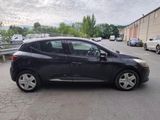 a picture of a black car parked on the side of the road