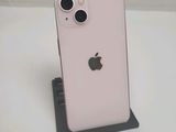 an apple iphone is sitting on a stand on a white surface