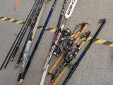 many different types of hockey sticks and sticks on the ground