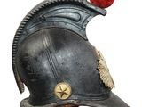 a black helmet with a red pom pom on it