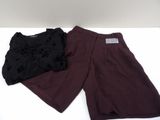 purple and black shorts on a white table with a black top