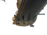 a close up of a large black object on a white surface