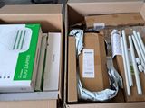 two boxes of electronic equipment sitting on a table