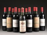 several bottles of wine are lined up in a row