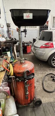 two cars parked in a garage next to a fire hydrant