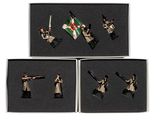 four figurines of soldiers in different poses