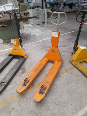two forklifts sitting on top of each other in a warehouse