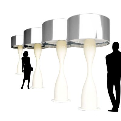 a silhouette of a man and a woman standing in front of a row of lamps