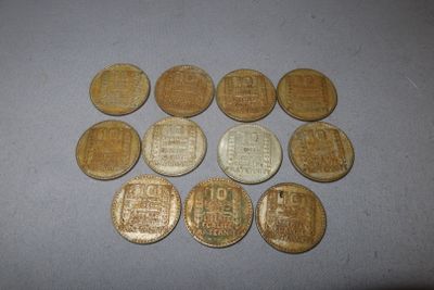 some old chinese coins sitting on top of a table
