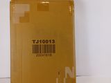 a yellow box with a barcode on it sitting on a table