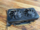 a close up of a video card sitting on top of a wooden table