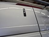an image of a car with a remote control on it ' s hood