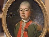 portrait d'un homme en uniforme militaire dans un cadre doré