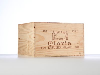 an empty wooden box sitting on top of a white table