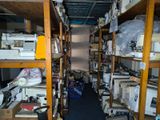 a room filled with lots of different types of sewing machines