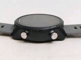 a close up of a smart watch on a white surface
