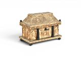 an image of a wooden box with carvings on it