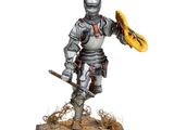 statue d'un chevalier muni d'une épée et d'un bouclier, posée sur un socle en bois