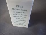 a white vase with a poem on it sitting on a table