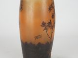 a vase that has a picture of a bench on it