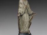 an image of a statue of a woman holding a staff
