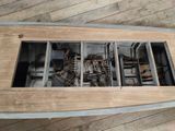 a wooden table with a bunch of wires inside of it