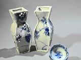 three vases sitting next to each other on a table