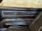 a black car with a black seat in the back of it