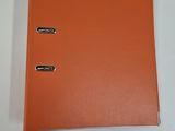 an orange binder with two metal clips on top of it