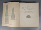 an open book with a drawing of a tower in the middle of it