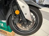 a motorcycle that is sitting on a pallet in a room