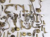 a lot of antique brass items on a white surface