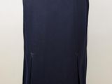 a woman ' s dress on a mannequin stand with a gold belt