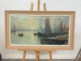 une photo d'un tableau posé sur un chevalet au bord de l'eau