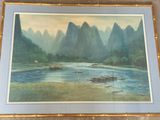 a picture of a painting of a river with mountains in the background
