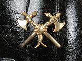 a picture of a black leather hat with two crossed axes on it