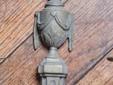 a metal object on a wood floor with a wooden floor