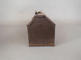 a small metal box with a bird on top of it