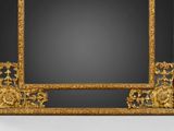 an image of a gold framed mirror with a black background