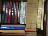 a box full of books sitting on the floor