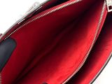 the inside of a red and black purse with a zipper