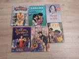 several children ' s books are lined up on a wooden floor