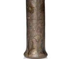 a vase that is sitting on a white surface