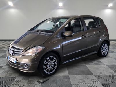 the mercedes b - class is parked on a checkered tile floor