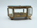 a glass box with a gold and blue design on it