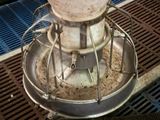 a metal mixer with a metal bowl on top of it